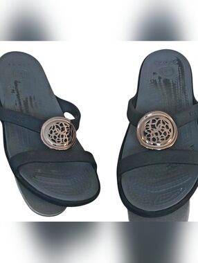 CROCS Women’s Black Slide Sandals with Rose Gold Medallion Accent